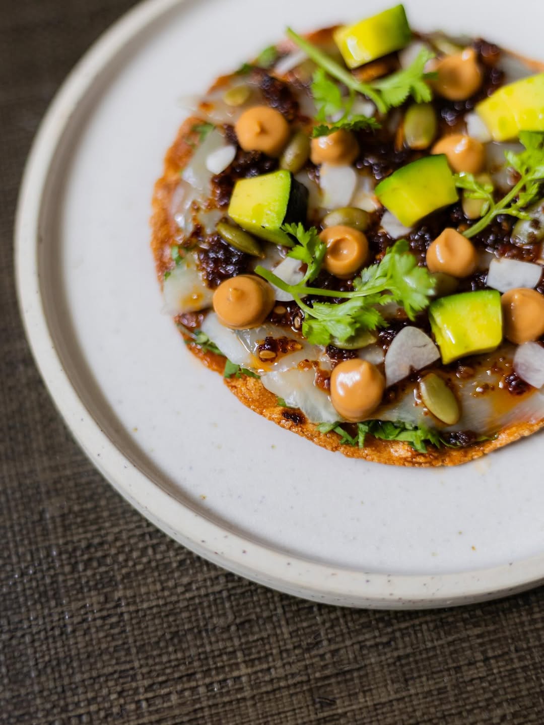 Fish Tostada — Smoked Pampano, Cashew Salsa Macha, Charred Avocado